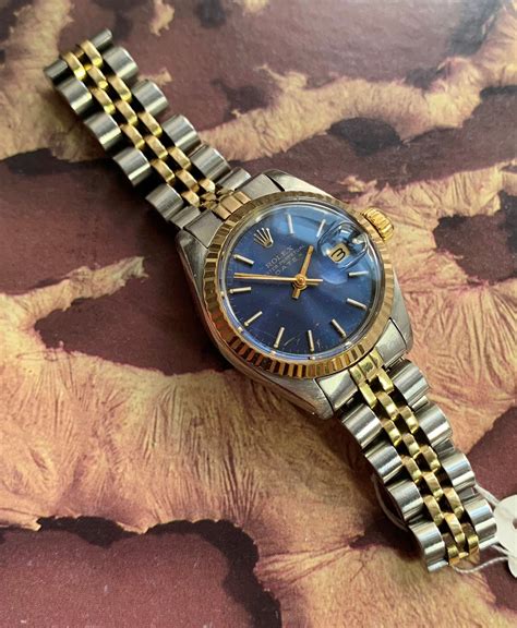 ladies rolex oyster perpetual date blue with gold bevel|rolex oyster perpetual 1970 value.